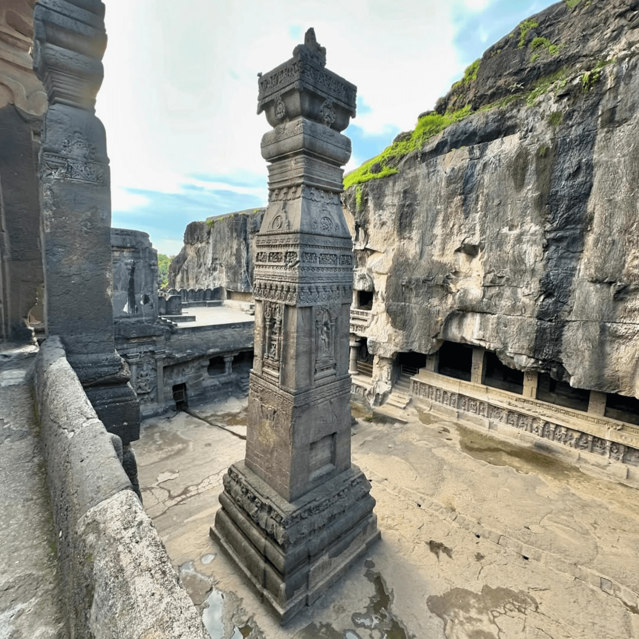 Intricately carved stone pillar at the Kailasa Temple, Ellora Caves in the inspiring world around Dhyaana Farms.