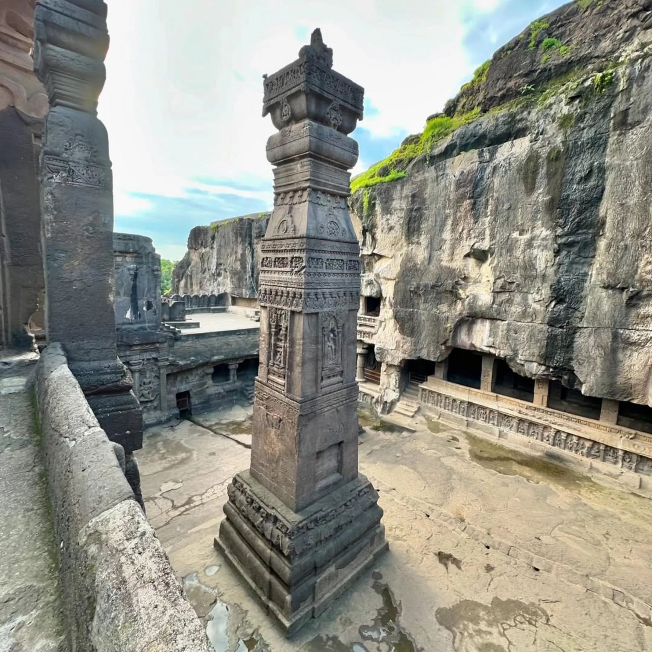 Intricately carved stone pillar at the Kailasa Temple, Ellora Caves in the inspiring world around Dhyaana Farms.