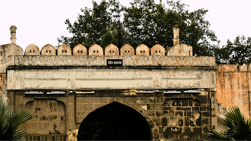 Luxury wellness farm stays are rising - Here is why! 4 Pani Darwaza entrance at Daulatabad Fort, Maharashtra, featuring Indo-Islamic architecture with arched doorway and stone walls